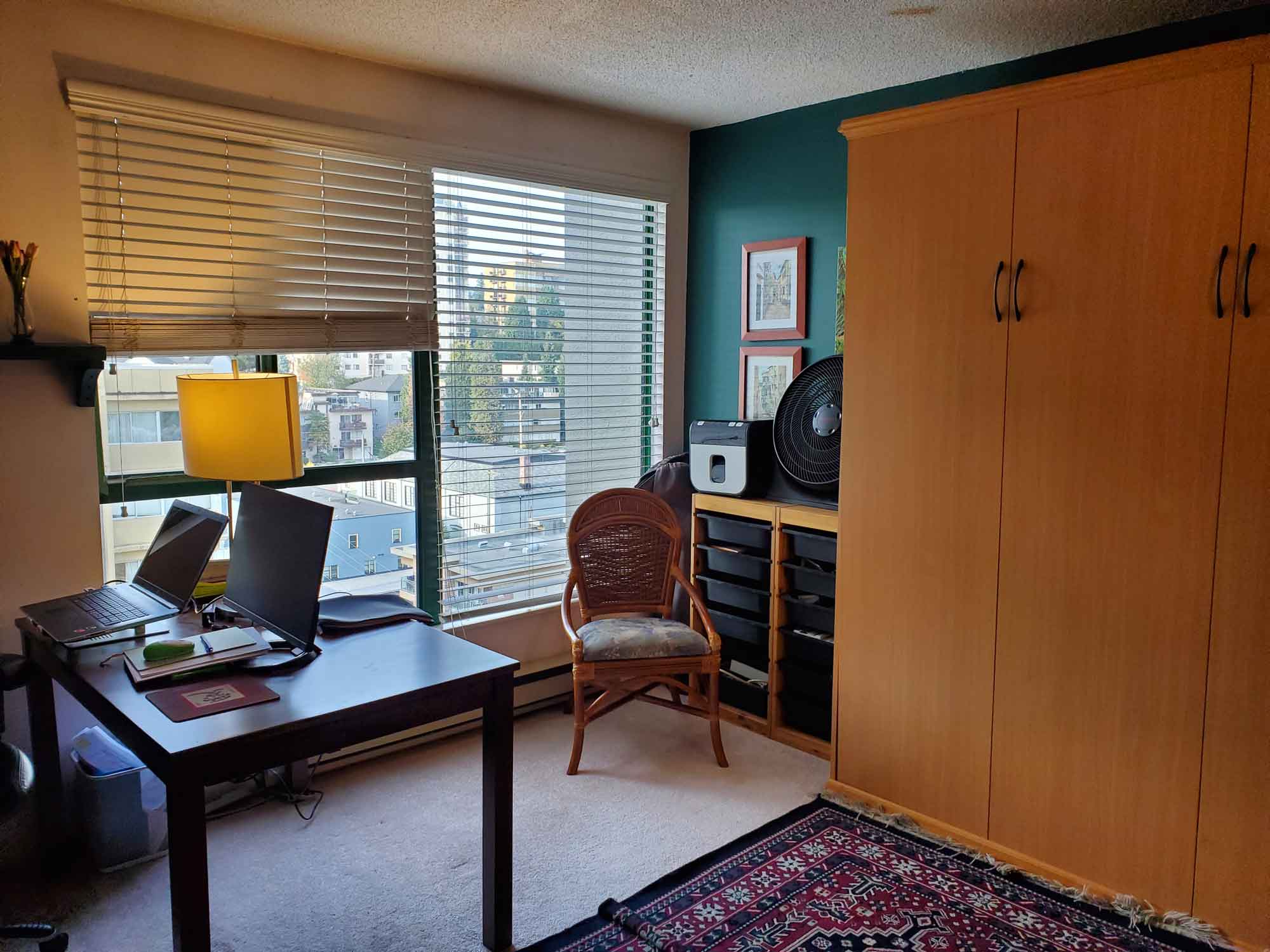 A spare room with the floor and desk cleared of boxes and non-essential items